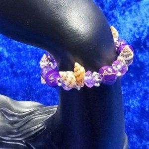 vintage pair of green and purple sea shell and beads stretch bracelets.